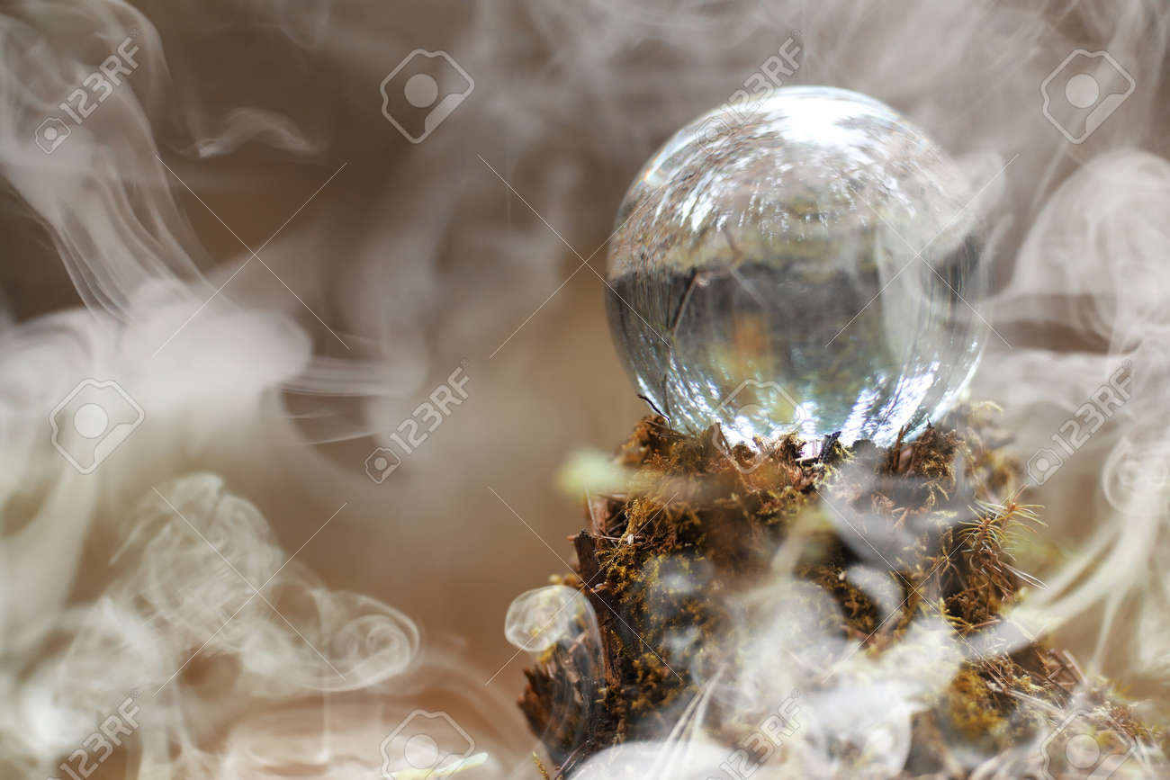 A crystal ball in the smoke. A magical accessory in the woods on - 96449791 A crystal ball in the smoke. A magical accessory in the woods on - 96449791