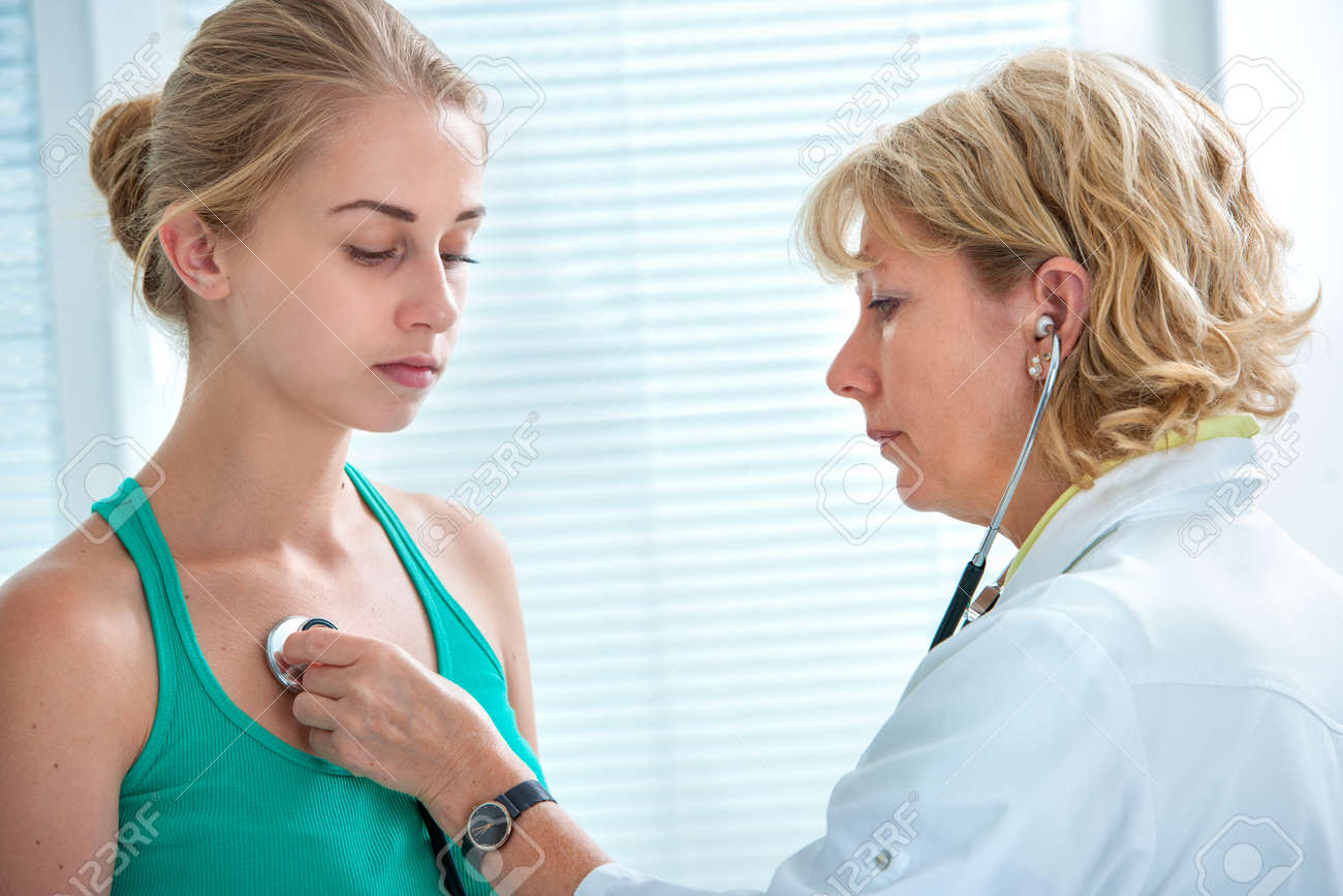 Doctor Examining Teen Girl Doctor Examining Teen Girl