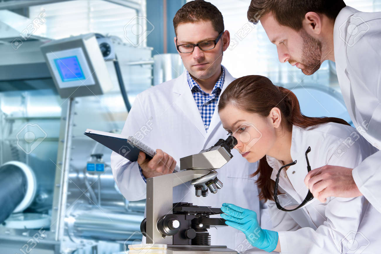 group of scientists working at the laboratory - 38495349 group of scientists working at the laboratory - 38495349