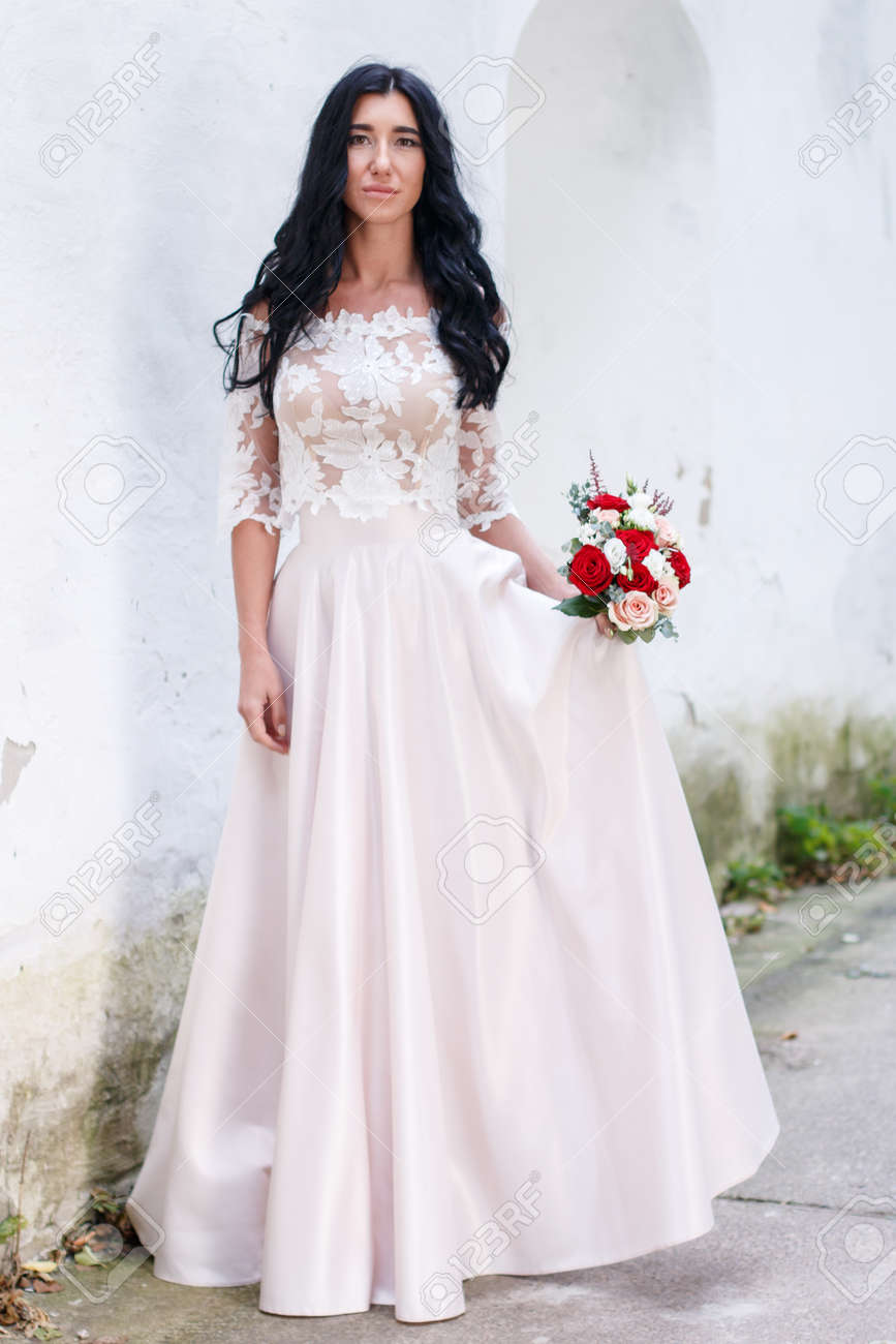 white wedding dress with red roses