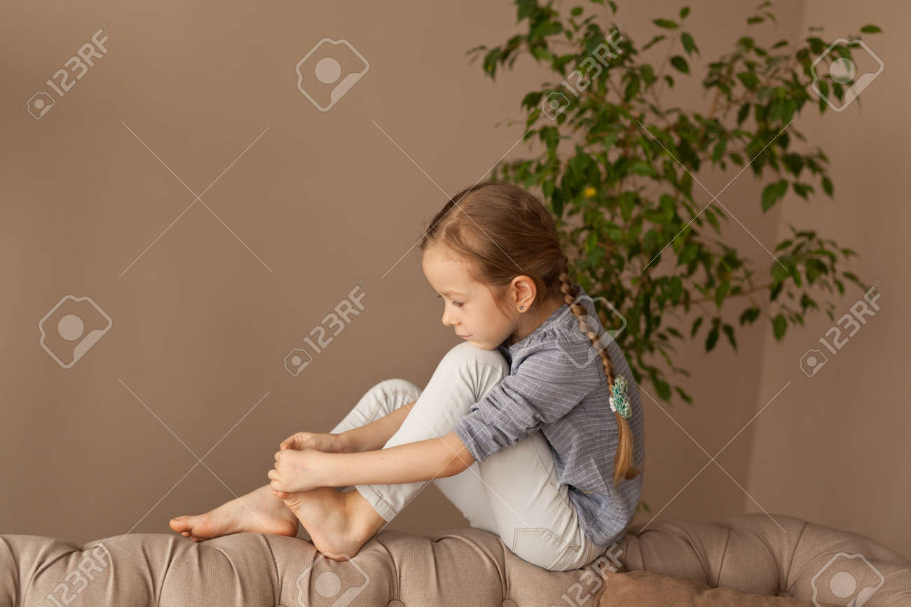 Portrait of a seven year old girl at home - 127281014 Portrait of a seven year old girl at home - 127281014