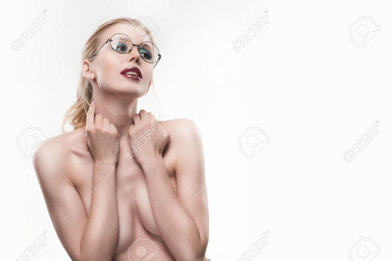 Beautiful Naked Shoulders Young Girl Wearing Round Glasses Portrait Covers  Her Topless Breasts With Her Hands Isolated On White. Copy Space.  Advertising, Conceptual And Commercial Design. Stock Photo, Picture and  Royalty Free