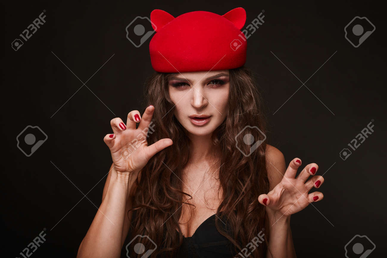 Beauty portrait of young swag sexy woman with curly long hair..