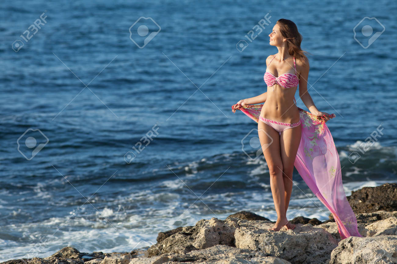 Girl At The Sea Attractive Young Woman On Background Of Sea Lady In Pink Swimwear On The Beach Stock Photo Picture And Royalty Free Image Image 12152248