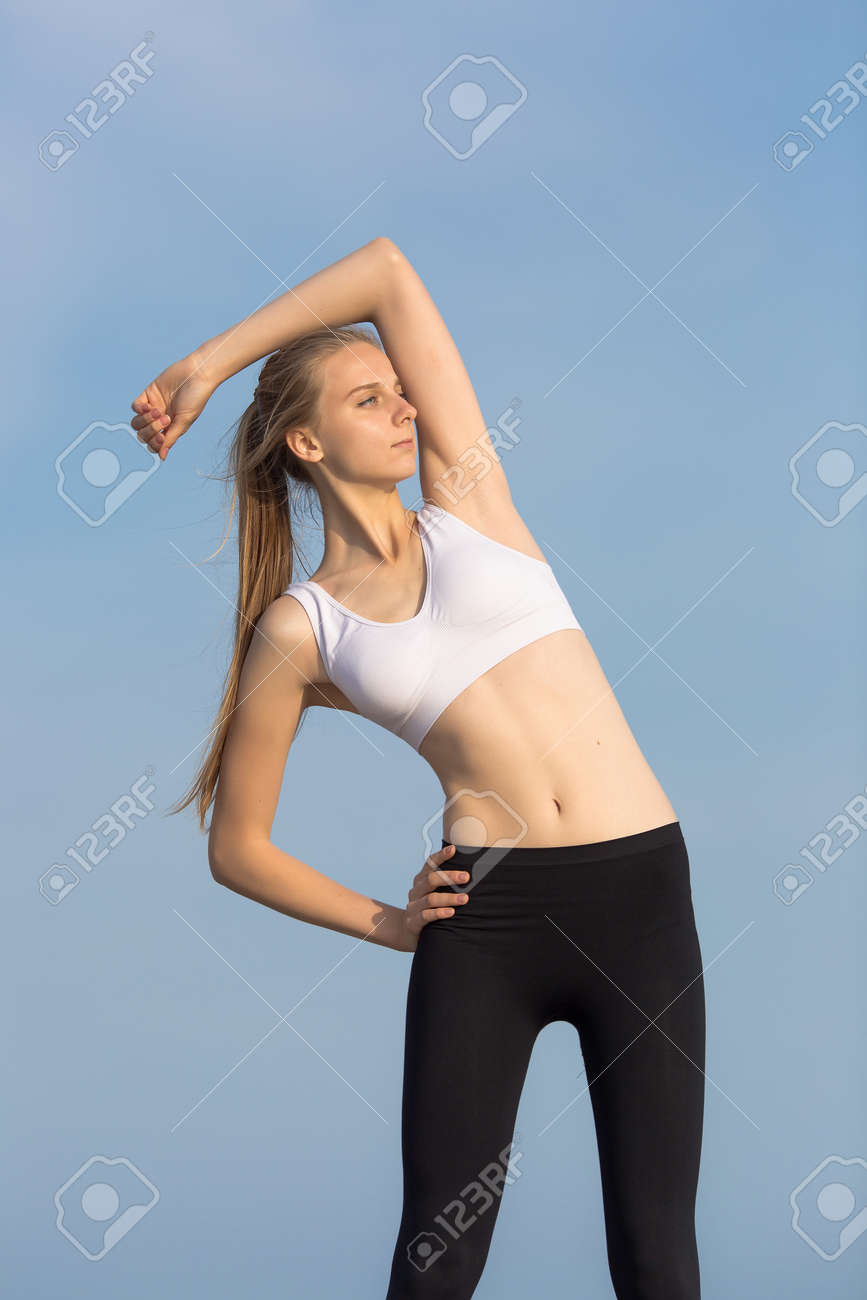 Slim Girl Does Morning Exercises Attractive Young Woman In Sportswear Stock Photo Picture And Royalty Free Image Image Slim Girl Does Morning Exercises Attractive Young Woman In Sportswear Stock Photo Picture And Royalty Free Image Image