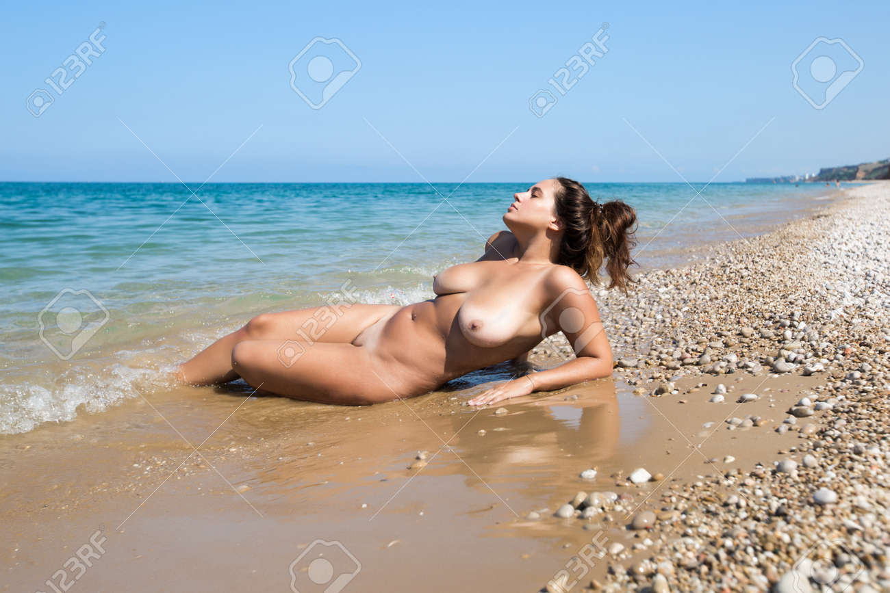 Female Person Resting On Pebble Sandy Beach Naked Young Female Person Resting On Pebble Sandy Beach Naked Young