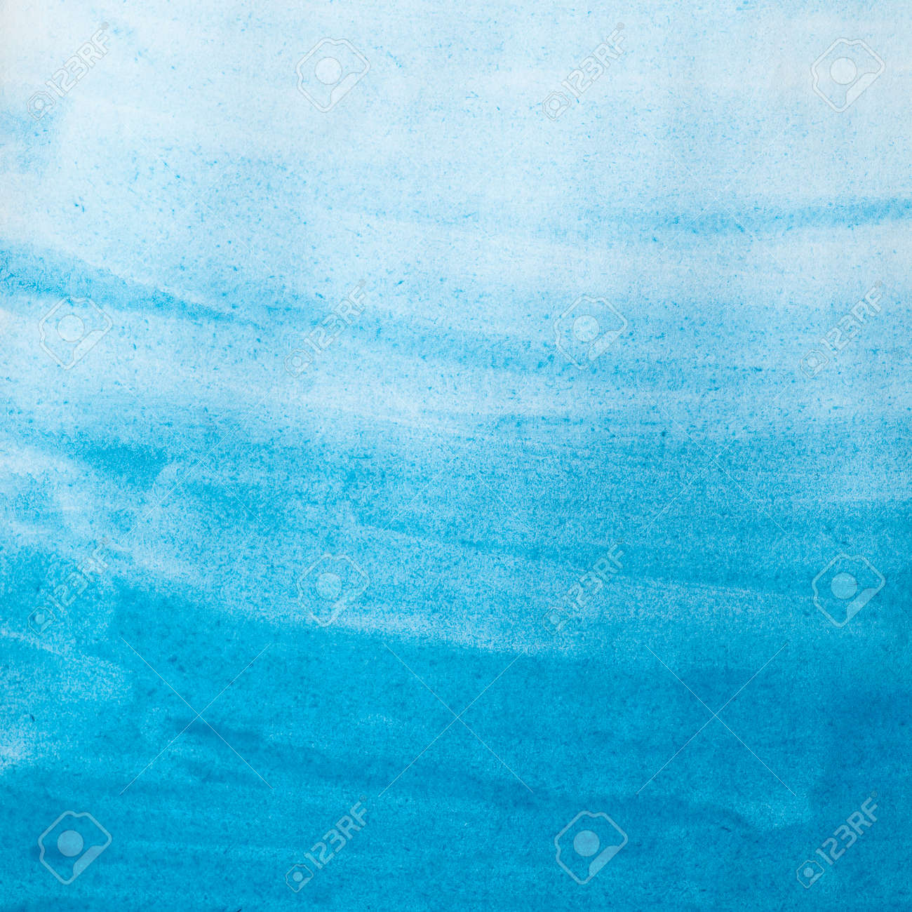 blue watercolor wash on paper texture abstract background stock