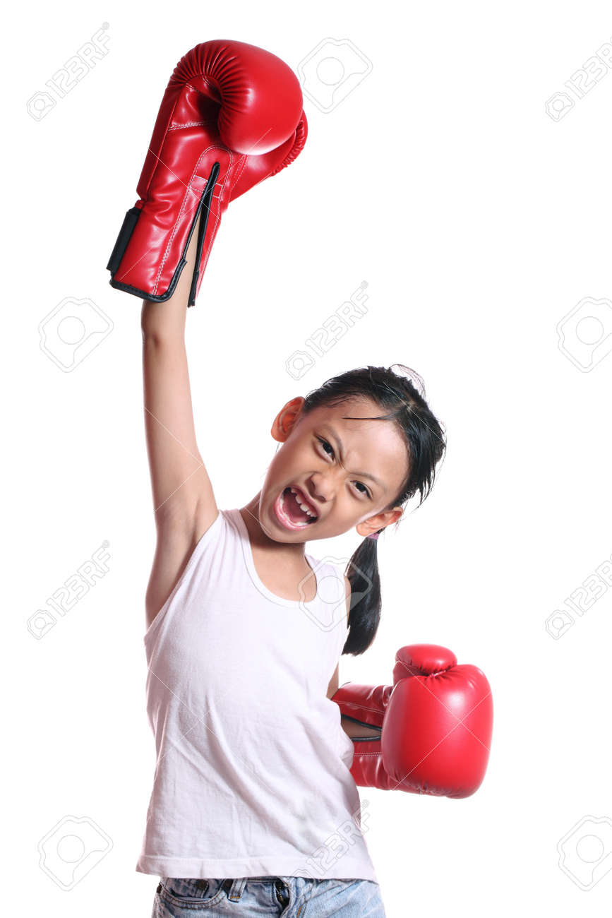 boxing gloves girl concept showing aggressive female flexing