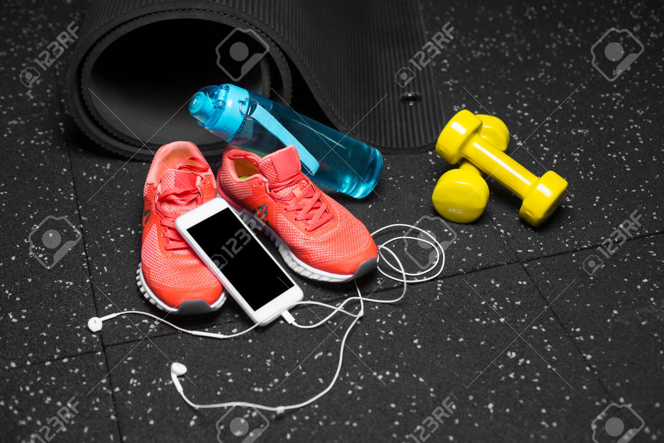 A Close Up Of Gym Accessories For Sport Training Dumb Bells