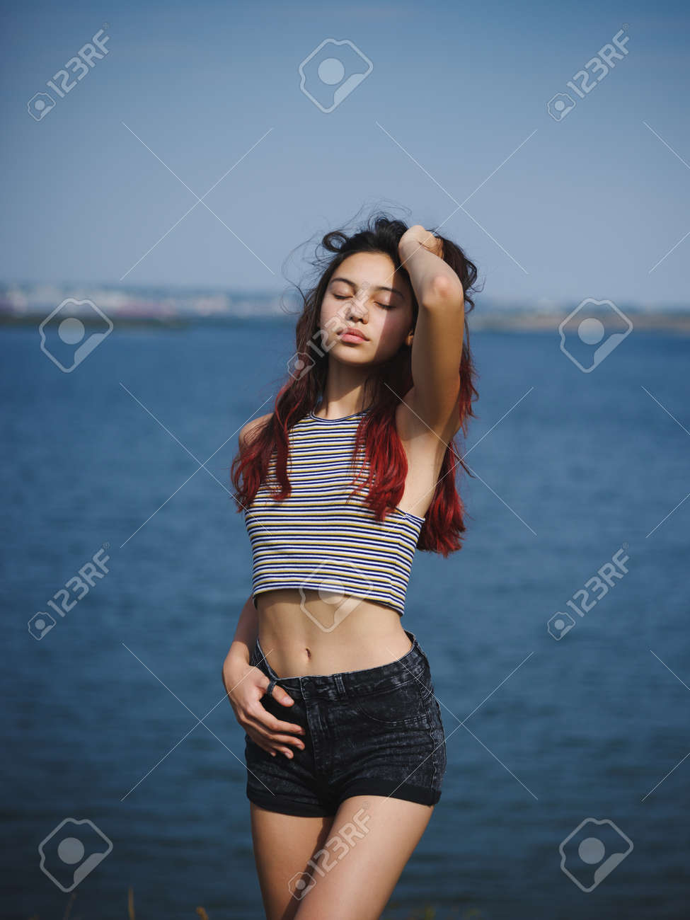 Sexy, Cute Young Girl Touching Her Hair