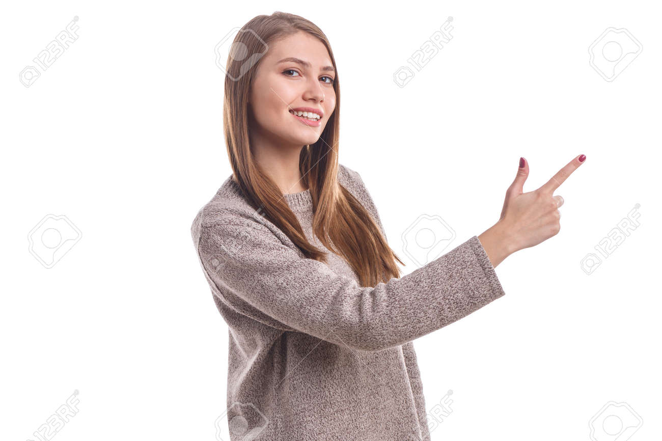 A Cute Brunette Girl Showing Her Index Finger Up And Smiling. Isolated.  Фотография, картинки, изображения и сток-фотография без роялти. Image  90841627