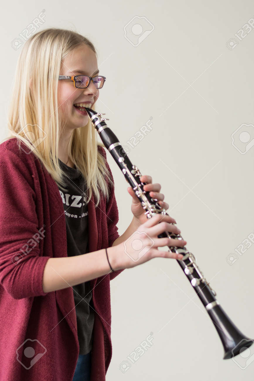 Girl Playing Clarinet And Starts Laughing