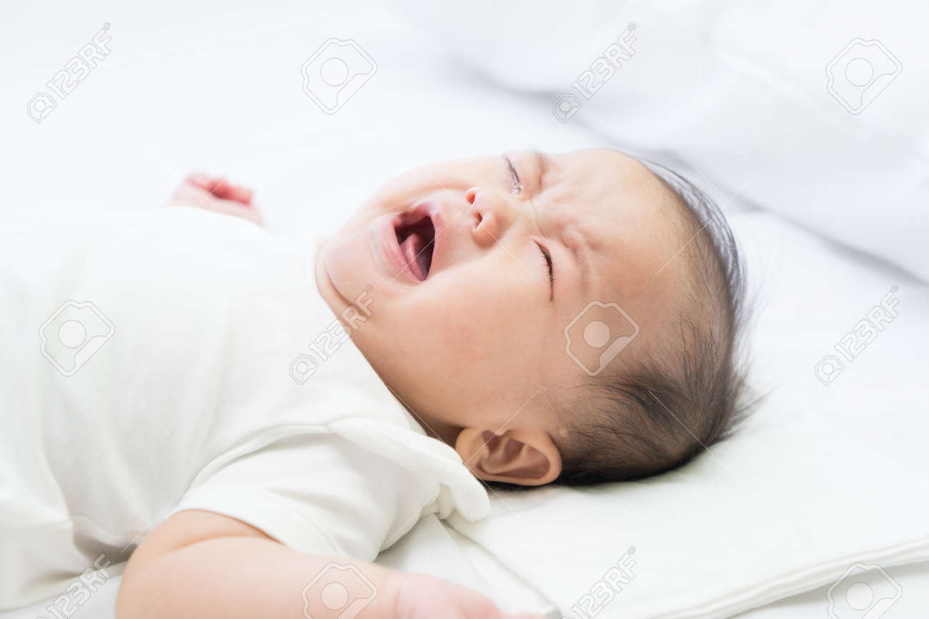Newborn Asian baby crying - 57206221 Newborn Asian baby crying - 57206221