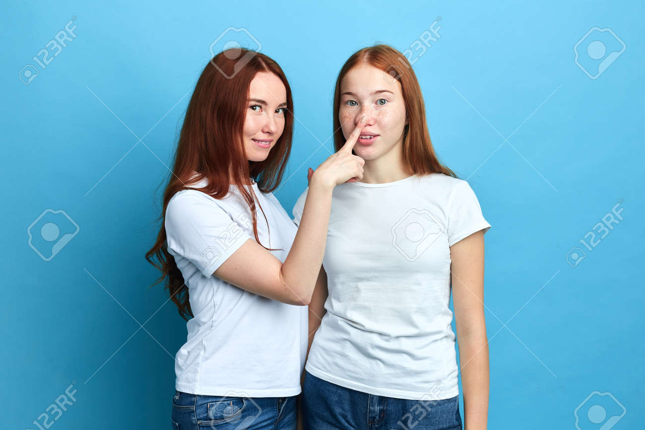 Funny Woman Touching Her Friend Nose