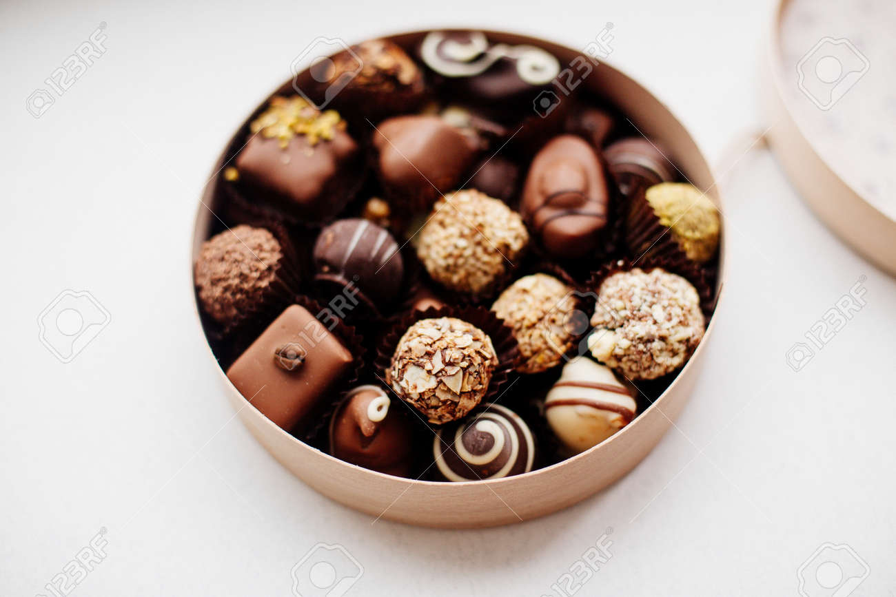 Round Box Of Chocolates On White Background Assorted Chocolates