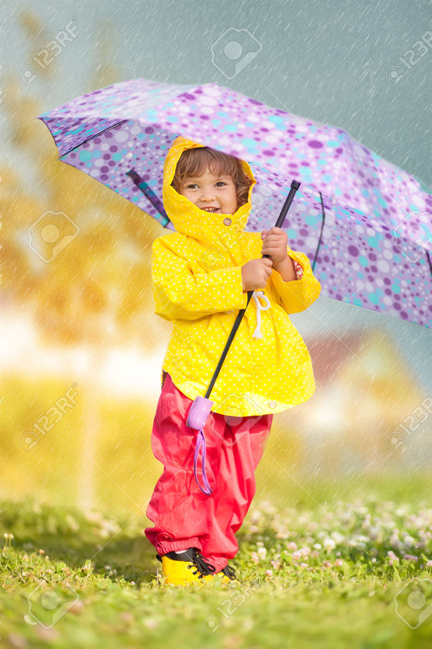 child with colorful umbrella