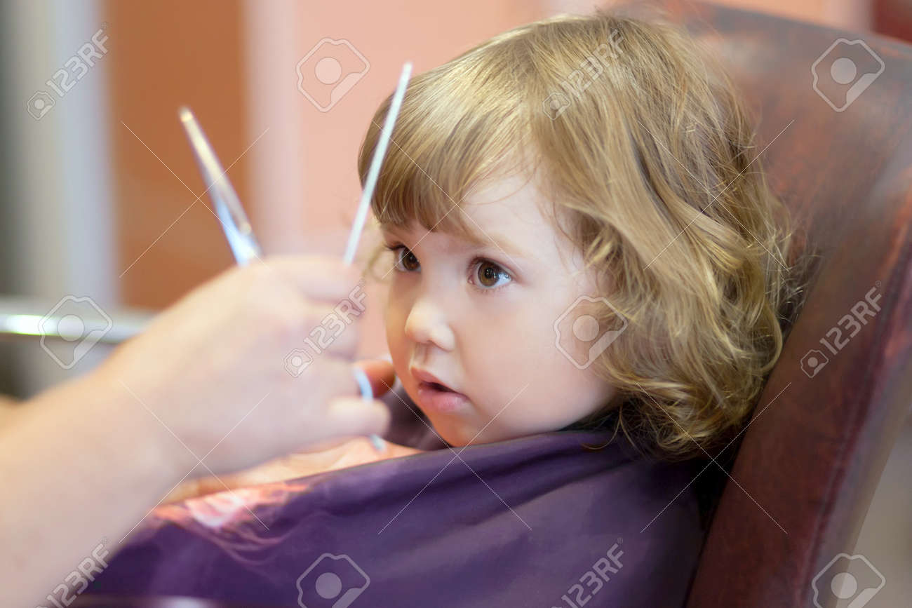 First Hair Cut Little Girl At The Beauty Salon