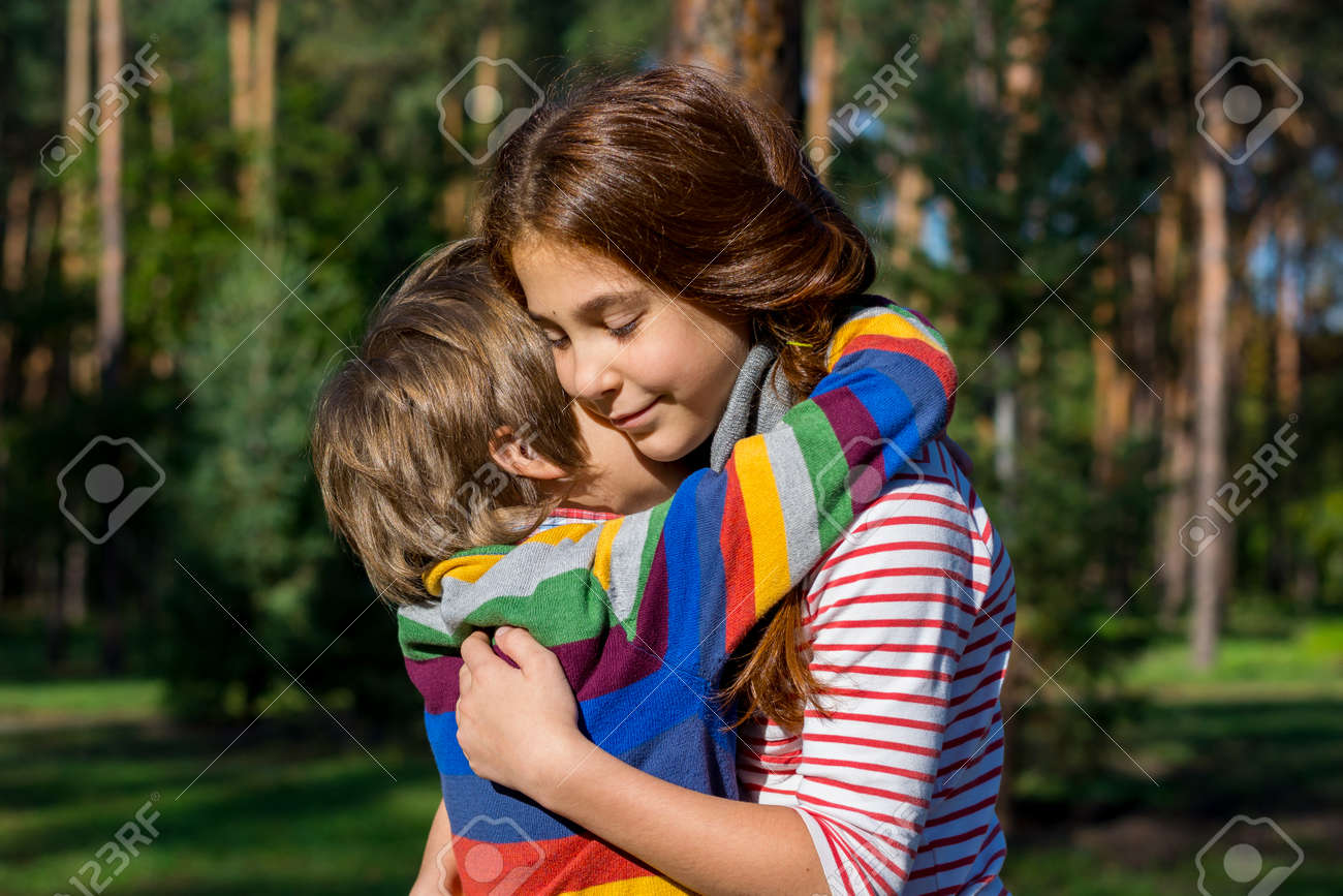 red haired girl hugging