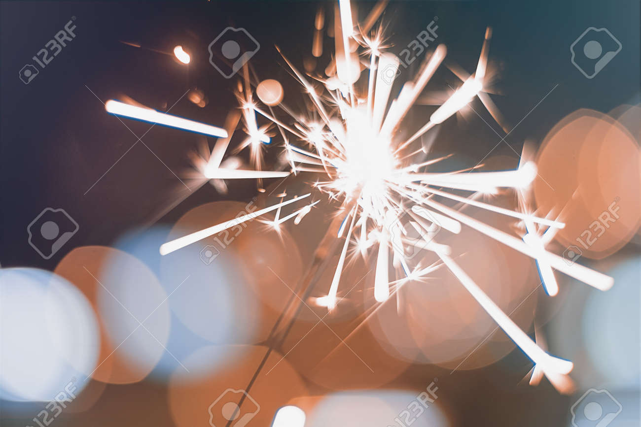 Night background with a sparkler. Sparkler Bokeh Colorful sparkler. Shallow focus - 68722495 Night background with a sparkler. Sparkler Bokeh Colorful sparkler. Shallow focus - 68722495