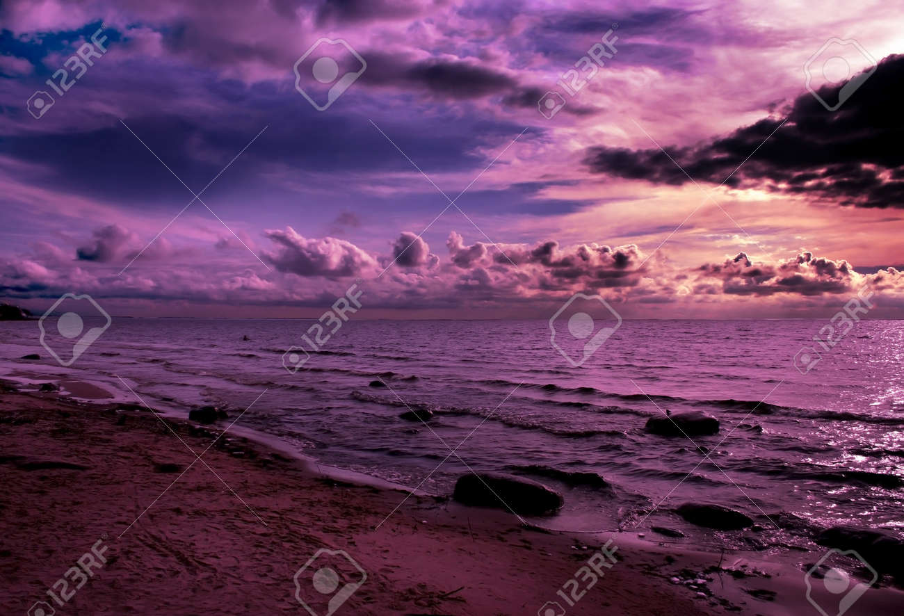 Beautiful sunset over the Riga Bay. Vanilla clouds in the sky. Almost night in the city of Saulkrasti, which is about 50 km from Riga - capital of Latvia. - 9413570 Beautiful sunset over the Riga Bay. Vanilla clouds in the sky. Almost night in the city of Saulkrasti, which is about 50 km from Riga - capital of Latvia. - 9413570