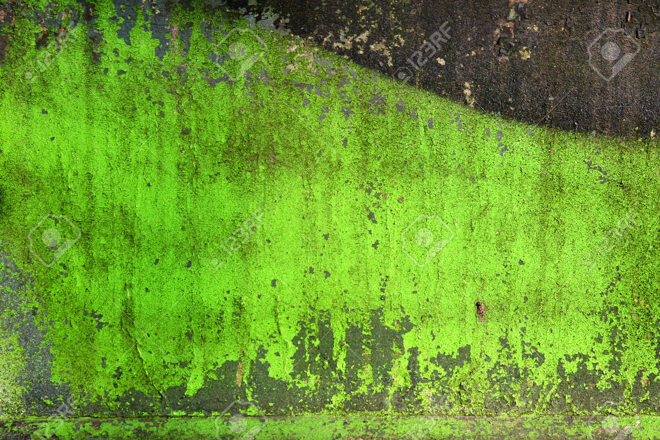 Grunge background / texture on a cracked green stone wall with splashes of paint. - 9485259 Grunge background / texture on a cracked green stone wall with splashes of paint. - 9485259