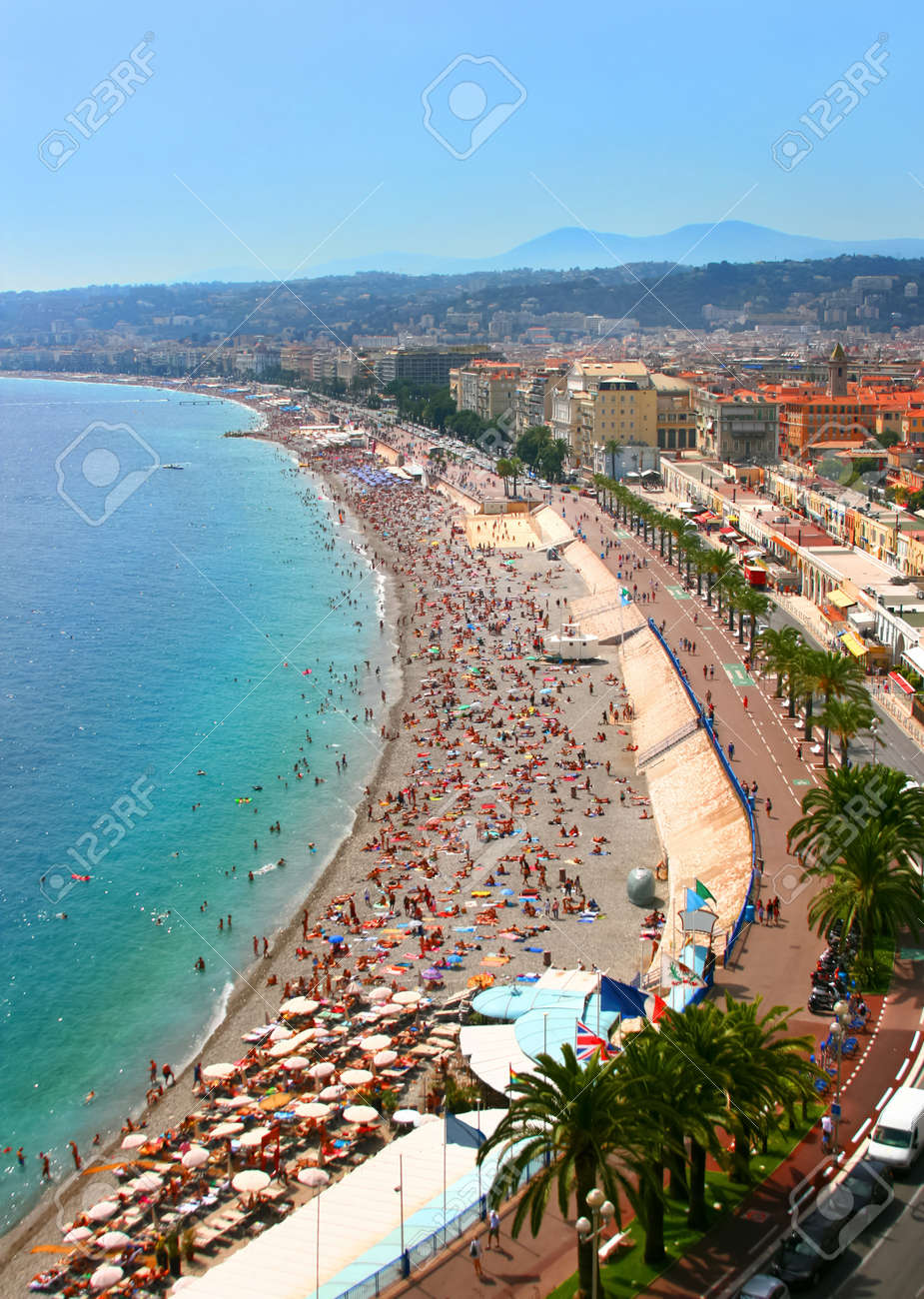 Luxury resort of French riviera. Fantastic panorama city of Nice in France. Sunny, summer day. Mediterranean sea, public beach, famous quay, palms and houses of Nice. - 10291300 Luxury resort of French riviera. Fantastic panorama city of Nice in France. Sunny, summer day. Mediterranean sea, public beach, famous quay, palms and houses of Nice. - 10291300
