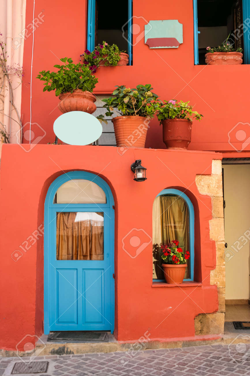 Colorful quiet backyard with beautiful flowers and classic traditional architecture in city of Chania on island of Crete, Greece - 19740671 Colorful quiet backyard with beautiful flowers and classic traditional architecture in city of Chania on island of Crete, Greece - 19740671