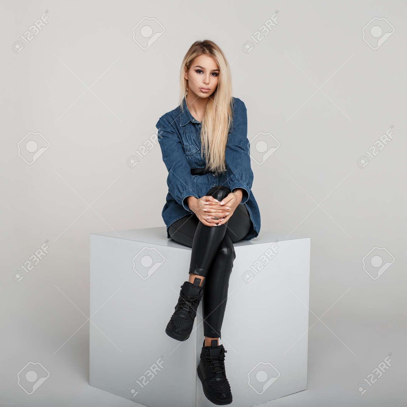 black pants and denim shirt