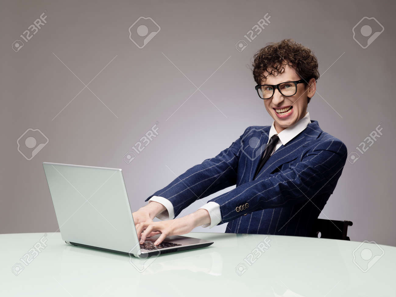 Funny Business Man Geek Using Laptop With Evil Genius Facial Expression Stock Photo Picture And Royalty Free Image Image