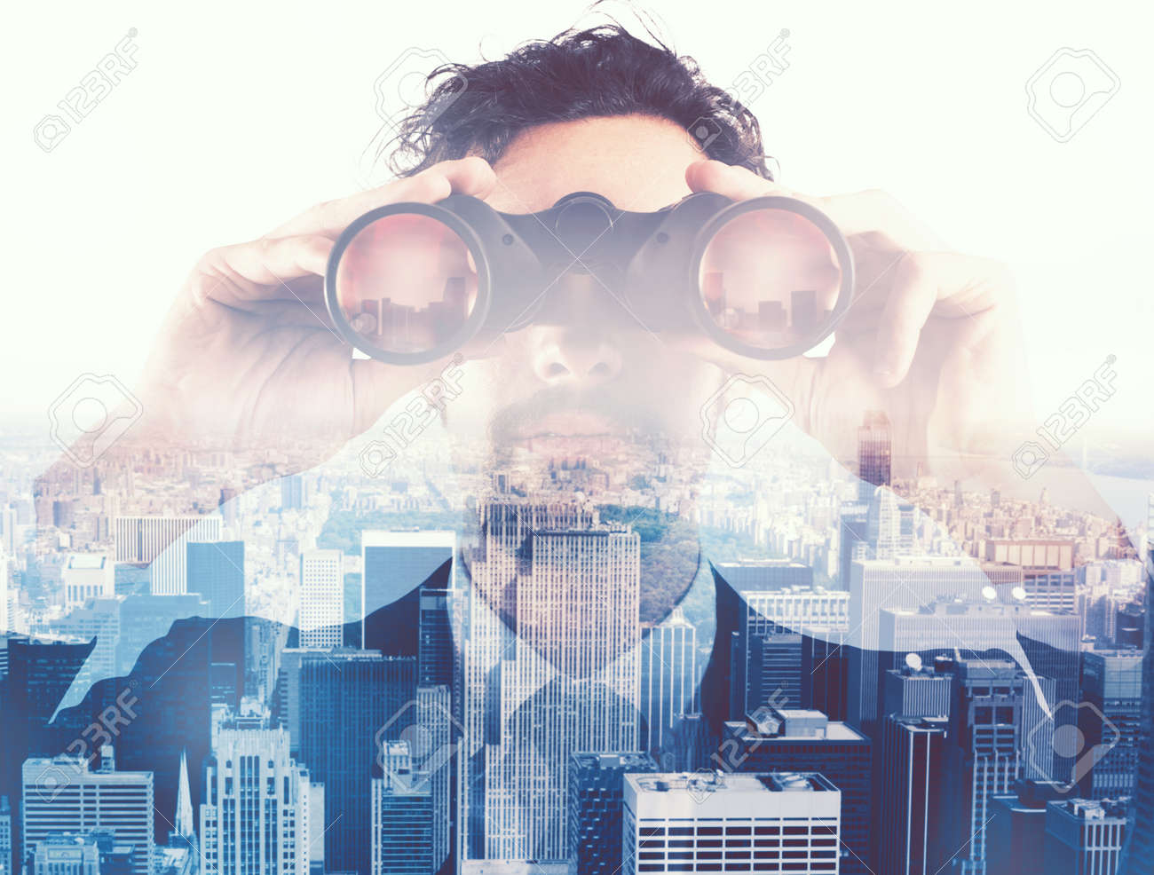 Businessman looking to the future with binoculars - 85533427 Businessman looking to the future with binoculars - 85533427