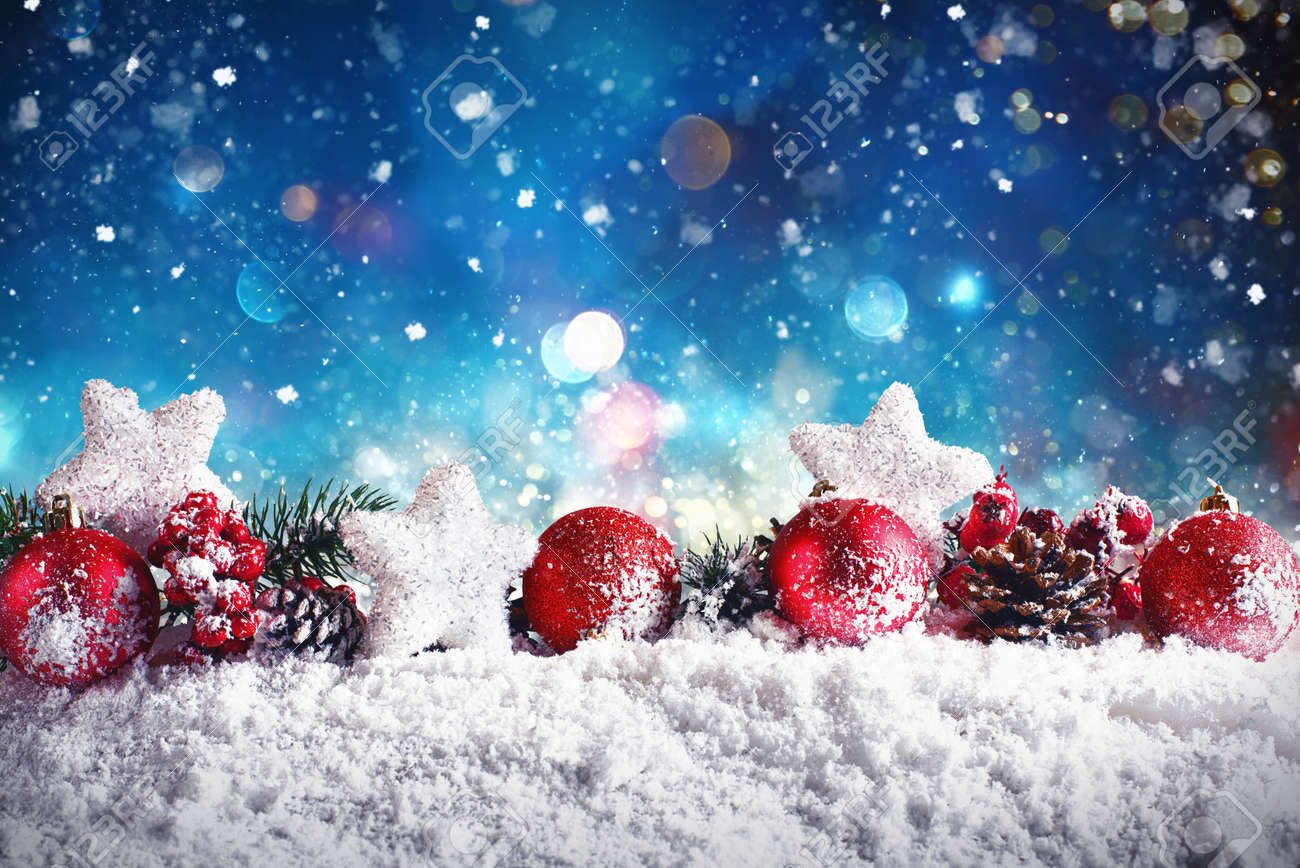 Christmas composition with balls,stars and garlands on snow with night light - 89249642 Christmas composition with balls,stars and garlands on snow with night light - 89249642
