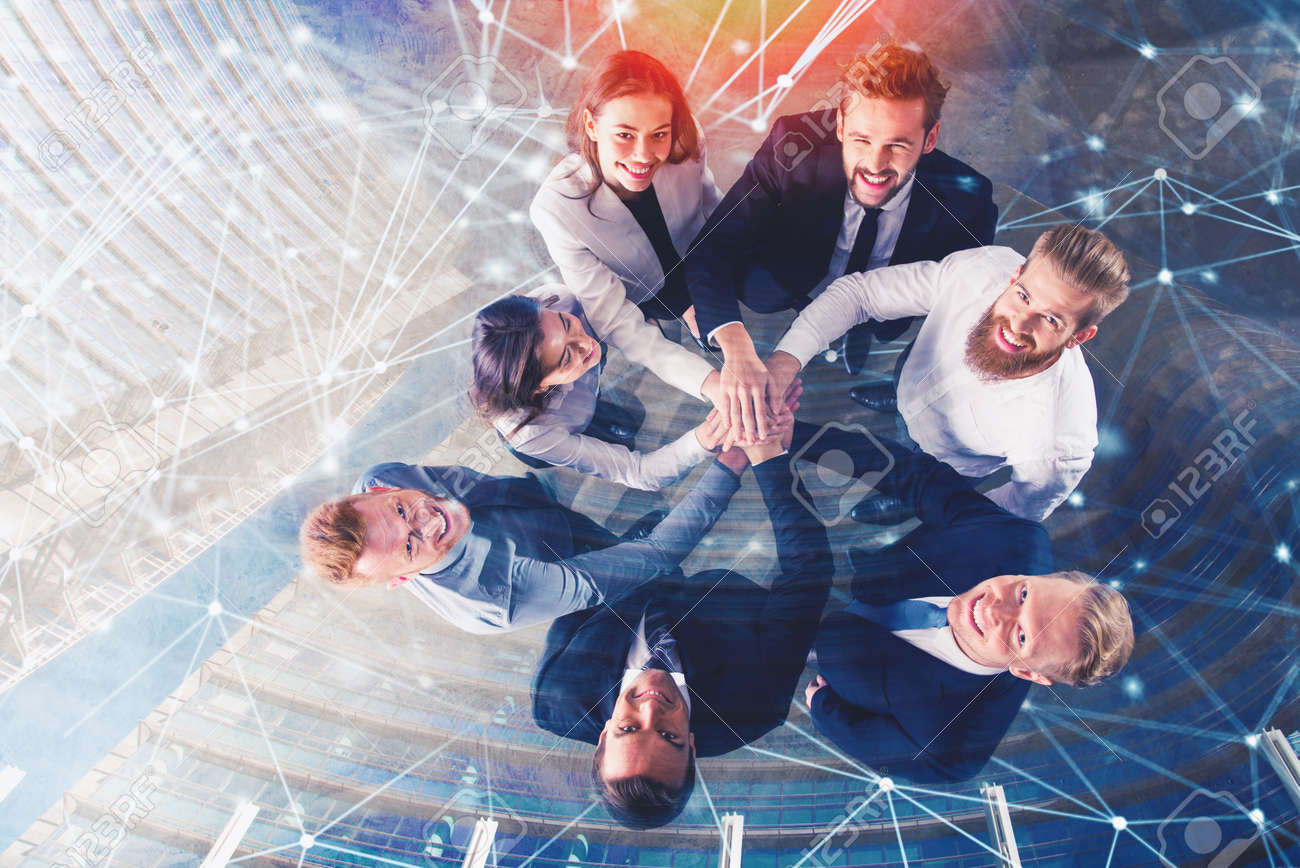 Business people putting their hands together with internet network effects. Concept of integration, teamwork and partnership. double exposure - 99898021 Business people putting their hands together with internet network effects. Concept of integration, teamwork and partnership. double exposure - 99898021