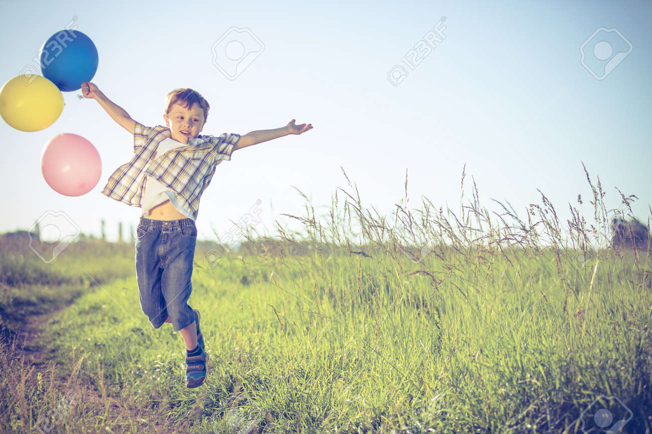 Happy Little Boy On Road At The Day Time He Running In The Field Happy Little Boy On Road At The Day Time He Running In The Field