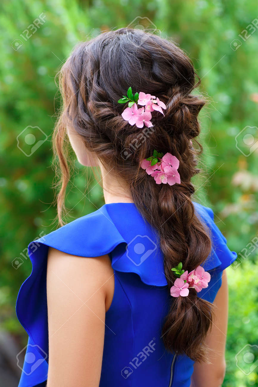 Elegant Hairstyle With Fresh Flowers In A Plait Woman With