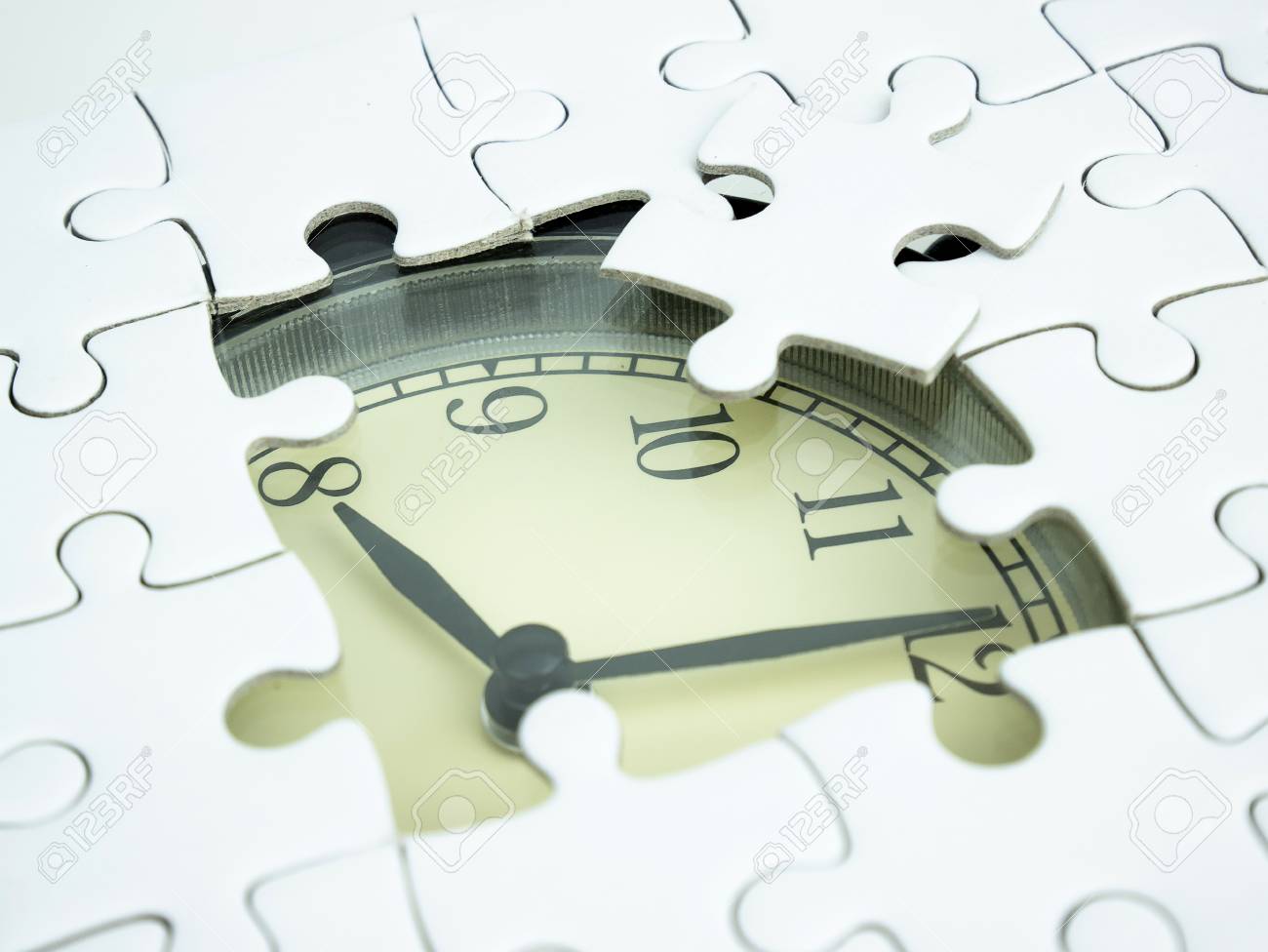 Missing Jigsaw Puzzle Pieces On Alarm Clock Background Business Stock Photo Picture And Royalty Free Image Image 102438195