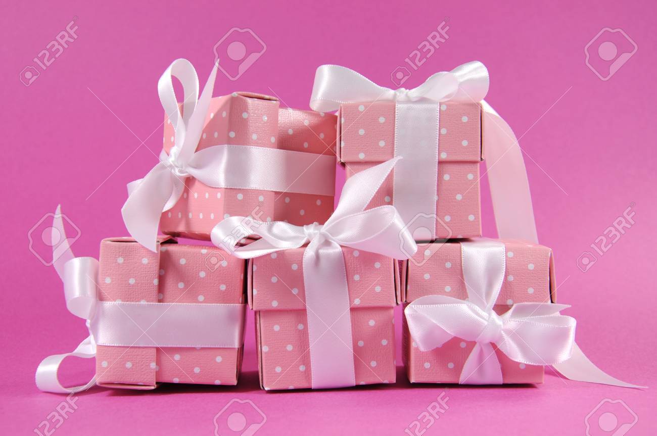 Stack Of Pretty Pink Polka Dot Present Gift Boxes With White Ribbon For Christmas Valentine Birthday Or Mothers Day Greeting Stock Photo Picture And Royalty Free Image Image