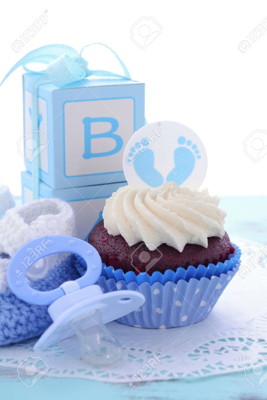 its a boy blue baby shower cupcakes with baby feet toppers and decorations on shabby chic - Decorating Baby Shower Cupcakes its a boy blue baby shower cupcakes with baby feet toppers and decorations on shabby chic - Decorating Baby Shower Cupcakes