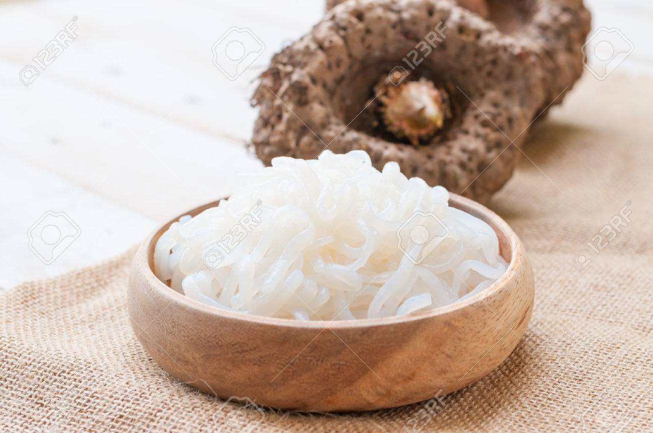 Shirataki noodle, konjac on white wooden board - 43591497 Shirataki noodle, konjac on white wooden board - 43591497