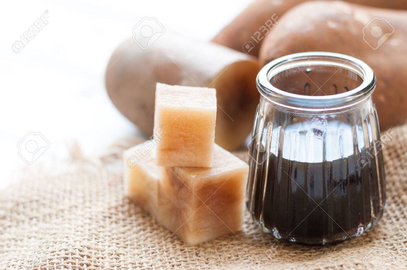 Fresh Yacon roots with yacon syrup on wooden board - 58955542 Fresh Yacon roots with yacon syrup on wooden board - 58955542