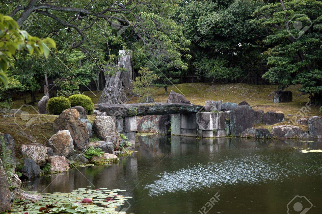 japanese garden with stone bridge rocksand lotus flowers stock photo 15800317 - Japanese Garden Stone Bridge japanese garden with stone bridge rocksand lotus flowers stock photo 15800317 - Japanese Garden Stone Bridge
