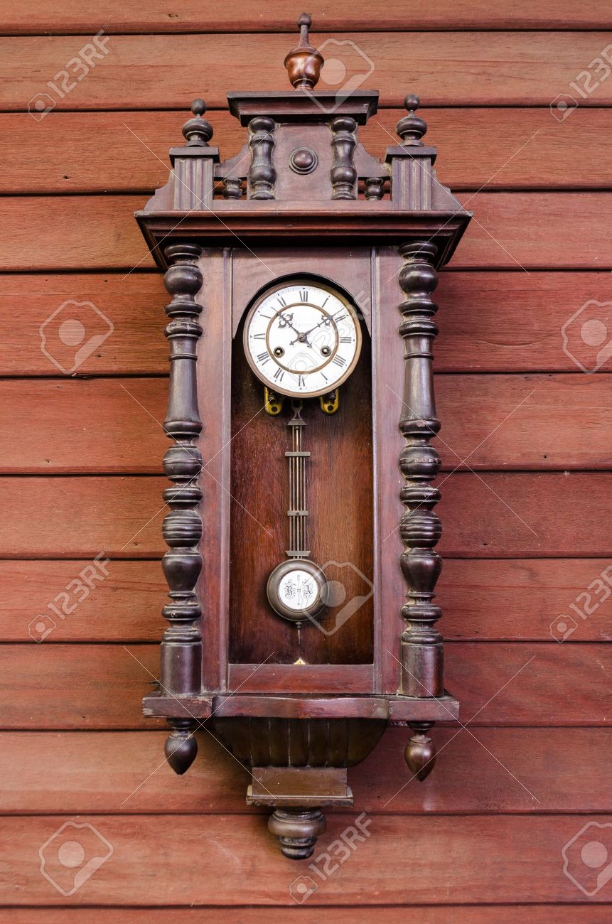 Antique Wooden Pendulum Clock Hanging On Wooden Wall Stock Photo Antique Wooden Pendulum Clock Hanging On Wooden Wall Stock Photo