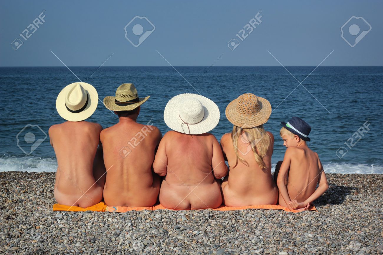 Naked family in the beach