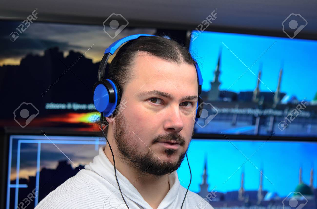 Photo Of The Video Broadcast Editor With Headphones Watching An Action On  The Monitor. Live TV Broadcasting Process Фотография, картинки, изображения  и сток-фотография без роялти. Image 83374425