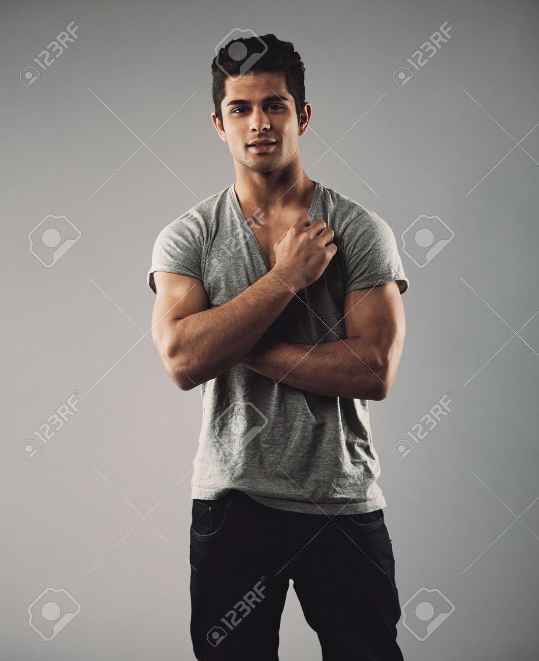 portrait of handsome young man posing confidently hispanic male