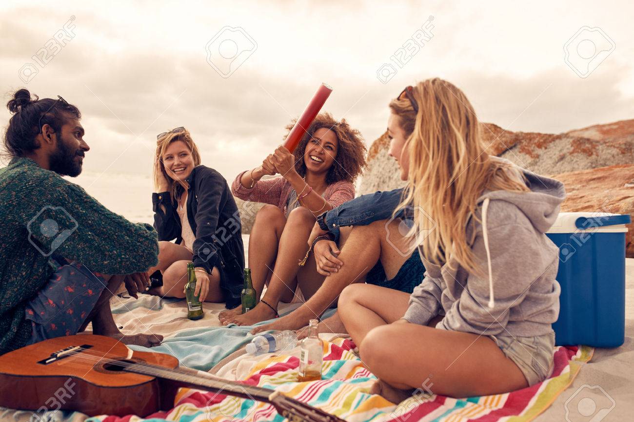 portrait of happy young people having fun at beach party group