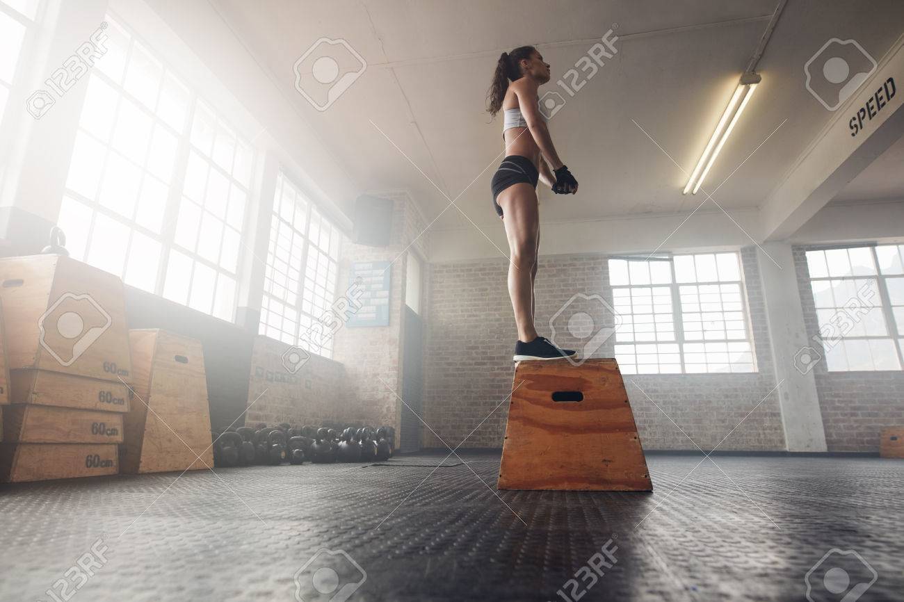 Low Angle Shot Of Fit Young Female Model In Sports Wear Standing
