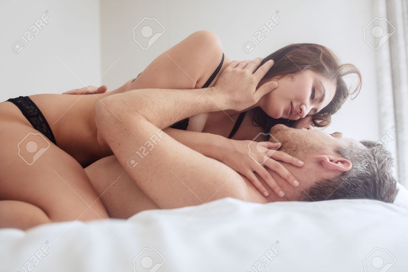 Beautiful Passionate Young Couple Lying On Bed And Having Sex Sensual Man And Woman Making Beautiful Passionate Young Couple Lying On Bed And Having Sex Sensual Man And Woman Making