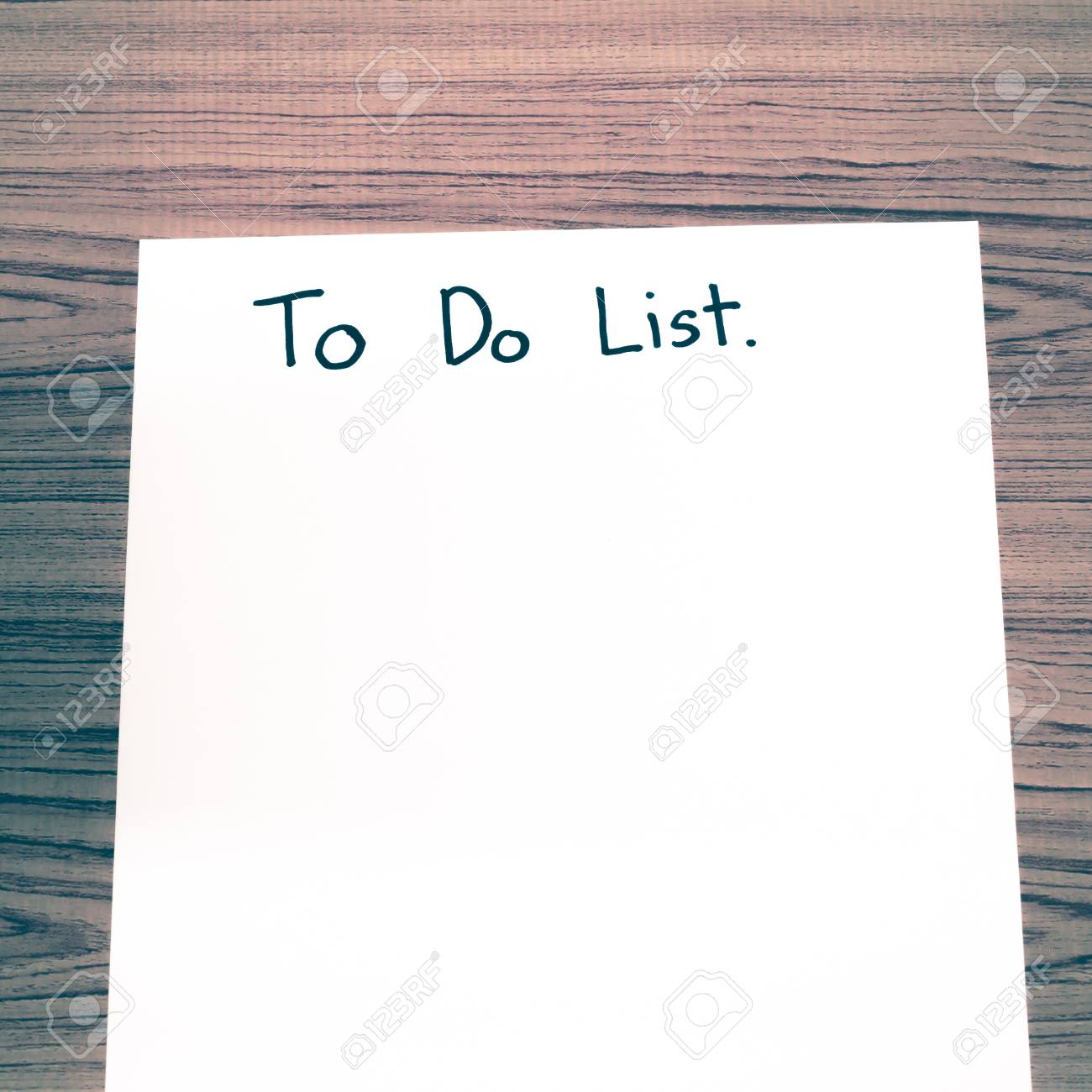 paper write to do list word on wood background vintage style stock