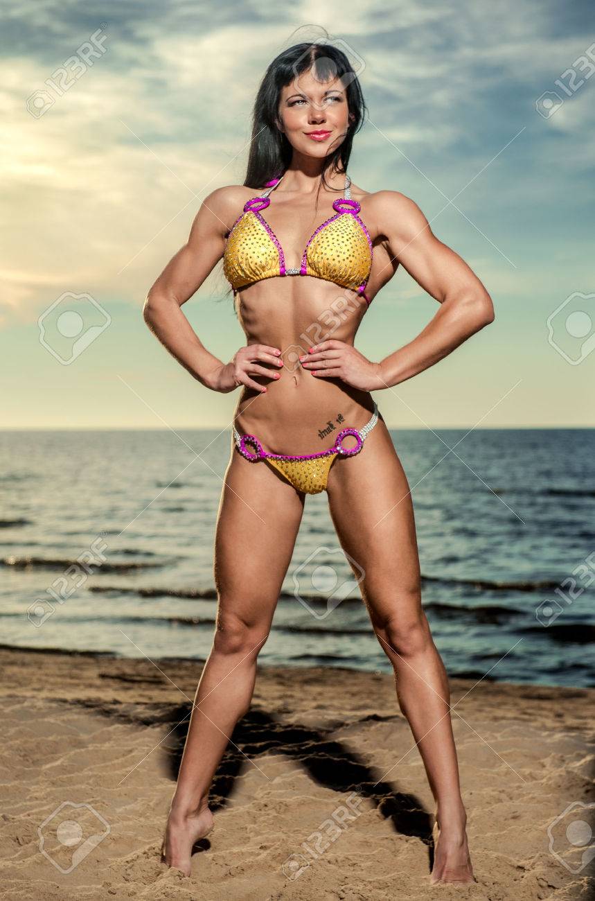 Sexy Muscular Build Brunette In Bikini Posing On The Beach Stock Photo,  Picture and Royalty Free Image. Image 22470817., image size:859x1300