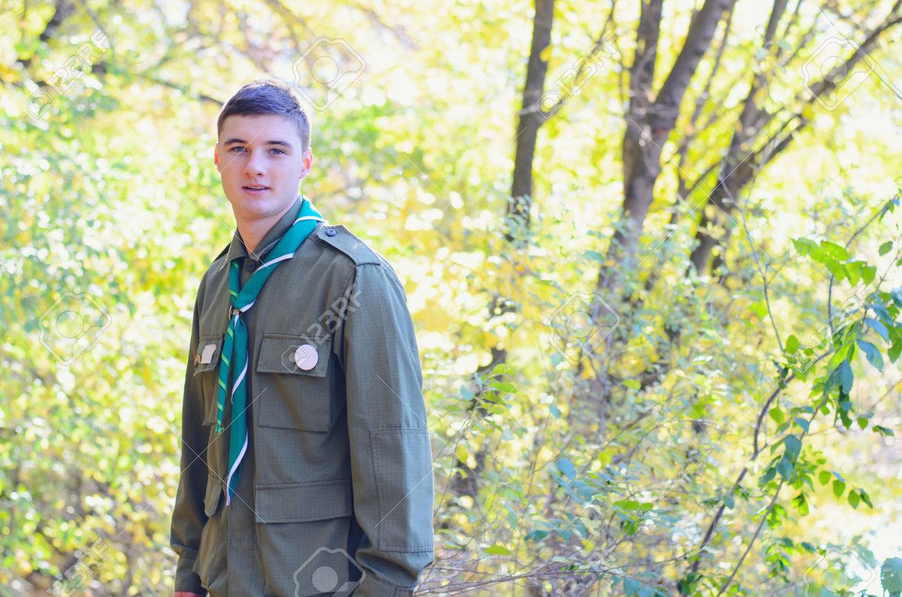 Waist Up Portrait of Boy Scout Wearing Uniform Standing in Forest on Sunny Day - 38260272 Waist Up Portrait of Boy Scout Wearing Uniform Standing in Forest on Sunny Day - 38260272